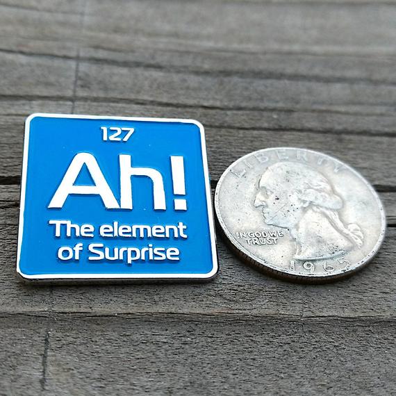 Ah! the element of surprise enamel pin